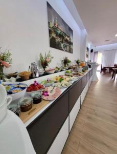 a buffet line with many plates of food on it at Lumen in Krakow