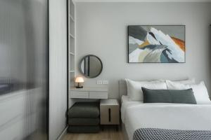 a bedroom with a bed and a mirror at A417-60m2-2bedroom Serenity 66935B2I976 in Nai Yang Beach