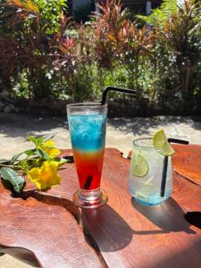 a drink in a glass on a wooden table at Amber Koh Rong in Koh Rong Island