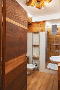 a bathroom with a toilet and a sink at BERTUZZI HOMES "Luxury Chalet" in Aprica +38 photos