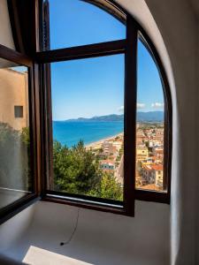 a window with a view of the ocean at Suite Il Mulino - Sea View in Sperlonga
