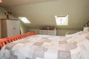 a bedroom with a large bed in a room at Skylark in Liskeard