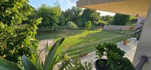 a view of a garden from the balcony of a house at Malo misto in Kovačić