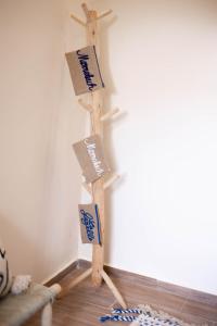 a wooden pole with signs on it in a room at Villa Dar Nata Marrakech in El Mers