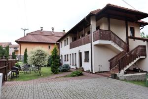 a house with a staircase and a patio at Salt Holiday in Praid