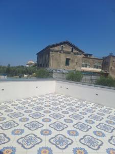 a tile floor on the roof of a building at Relais Soleil in Vico Equense +3 photos