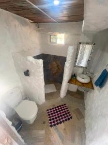a white bathroom with a toilet and a sink at brisas costeña in Santa Marta +12 photos