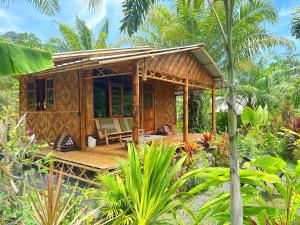 a small house in the middle of a garden at Tee Bungalow in the jungle in Ao Nang 