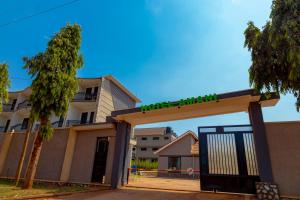 a building with a gate with a sign on it at Hotel Amani Limited in Mwana Island +30 photos