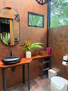 a bathroom with a sink and a mirror at Tee Bungalow in the jungle in Ao Nang  +110 photos
