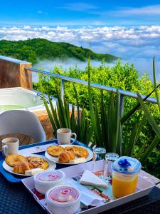 a tray of food on a table with a view at Glamping Jalisco in Buenavista