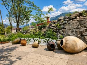 a group of vases sitting on the ground at Pottery House Sanahin in Alaverdi