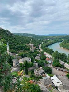 an aerial view of a town next to a river at Amra in Počitelj