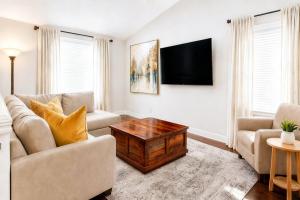 a living room with a couch and a table at PEAK AND PINE GETAWAY in Eden