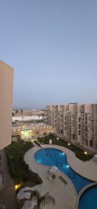 a view of a large apartment complex with a swimming pool at منتجع البرنسيسة ريزورت الغردقه in Hurghada