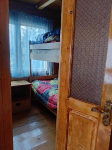 a small room with a bunk bed in a house at BBR House in Chʼkhakoura +5 photos