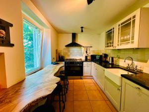 a kitchen with a wooden counter top in a room at Maison de gesves in Gesves