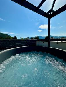 a hot tub on the roof of a house at Apartmán Raj in Rajecké Teplice