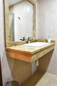 a bathroom with a sink and a mirror at Dilijan Tun Boutique Hotel in Dilijan +49 photos