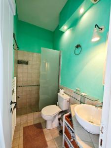 a bathroom with a toilet and a sink at KLIMA apartment in Perdika +12 photos