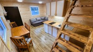 an aerial view of a tiny house kitchen and living room at SeaPort Resort in Łeba