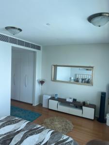 a room with a bed and a mirror on the wall at Marina private see view room in Abu Dhabi +42 photos
