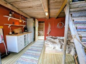 a kitchen with a bed in a room at Kolsta Gård 