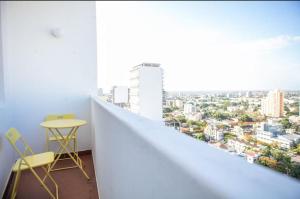 a balcony with a view of a city at Apartamento T3 Belém in Maputo