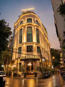 a large white building with a sign on it at Halo hotel & Spa hanoi in Hanoi