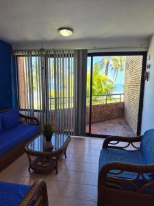 a living room with a couch and a table at relax en tucacas in Boca de Aroa