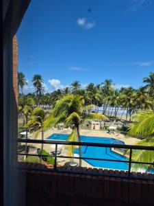 a view of the pool from the balcony of a resort at relax en tucacas in Boca de Aroa +2 photos