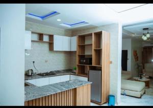 a kitchen with a counter top in a room at Blu Atlantic Apartment in Oshogbo