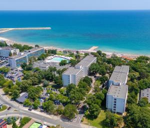 an aerial view of a city and the ocean at Hotel Semiramis in Saturn