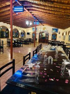 a long table in a large room with tables and chairs at Sun Lake Hotel in Tunis