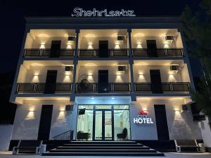 a hotel with a hotel sign on the front of it at shahrisabz city hotel in Shahrisabz