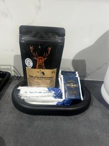 a gift box with a deer in it on a table at Apartament NOVA in Nowa Ruda