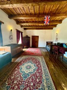a living room with a rug on the floor at Садиба Сцибор-Мархоцького in Otrokov