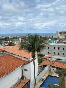 a view from the roof of a building with a palm tree at Salvador Backpackers House in Salvador