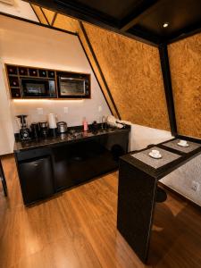 a kitchen with a counter in a room at Chalé Boa Vista in Duque de Caxias