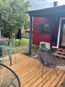 a deck with two chairs and a table and a house at Chalet Josef in Braunsbedra
