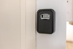 a black door handle on a white refrigerator at Central 1BR Flat Full Kitchen & Washing Machine in Andover +6 photos