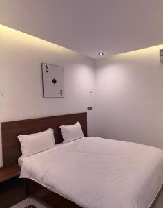 a bedroom with a large bed with white sheets at Junto Al Mar - Mini suite in San-Pédro +34 photos