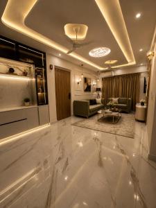 a living room with a large marble floor at Gurgaon Legacy in Gurgaon