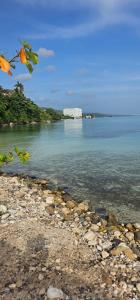 a view of a body of water with a rocky shore at Carib Ochi Rios condominium in Ocho Rios +8 photos