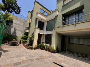 a house with a patio in front of it at Du Nepal Inn in Kathmandu