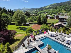 an aerial view of a resort with a swimming pool at Hôtel Le Labrador 1971 in Les Gets
