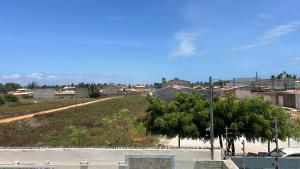 a view of a city with a street at Caueira Beach House in Itaporanga dʼAjuda +4 photos