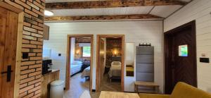 a room with a bedroom and a living room at Z Górki Na Pazurki in Polańczyk
