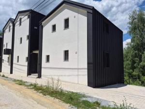 a house clad in black and white at Luxury aprtmans in Mavrovo