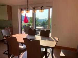 a dining room with a wooden table and chairs at Ferienhaus Louis Philippe in Altlay